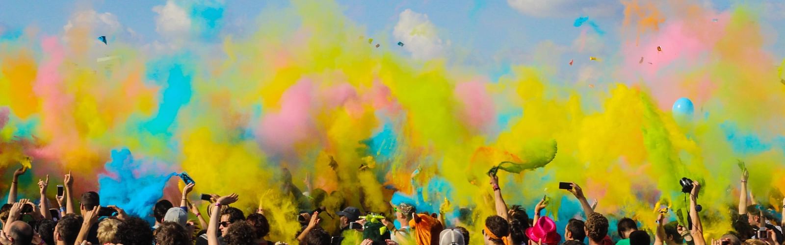 a group of people playing with colours