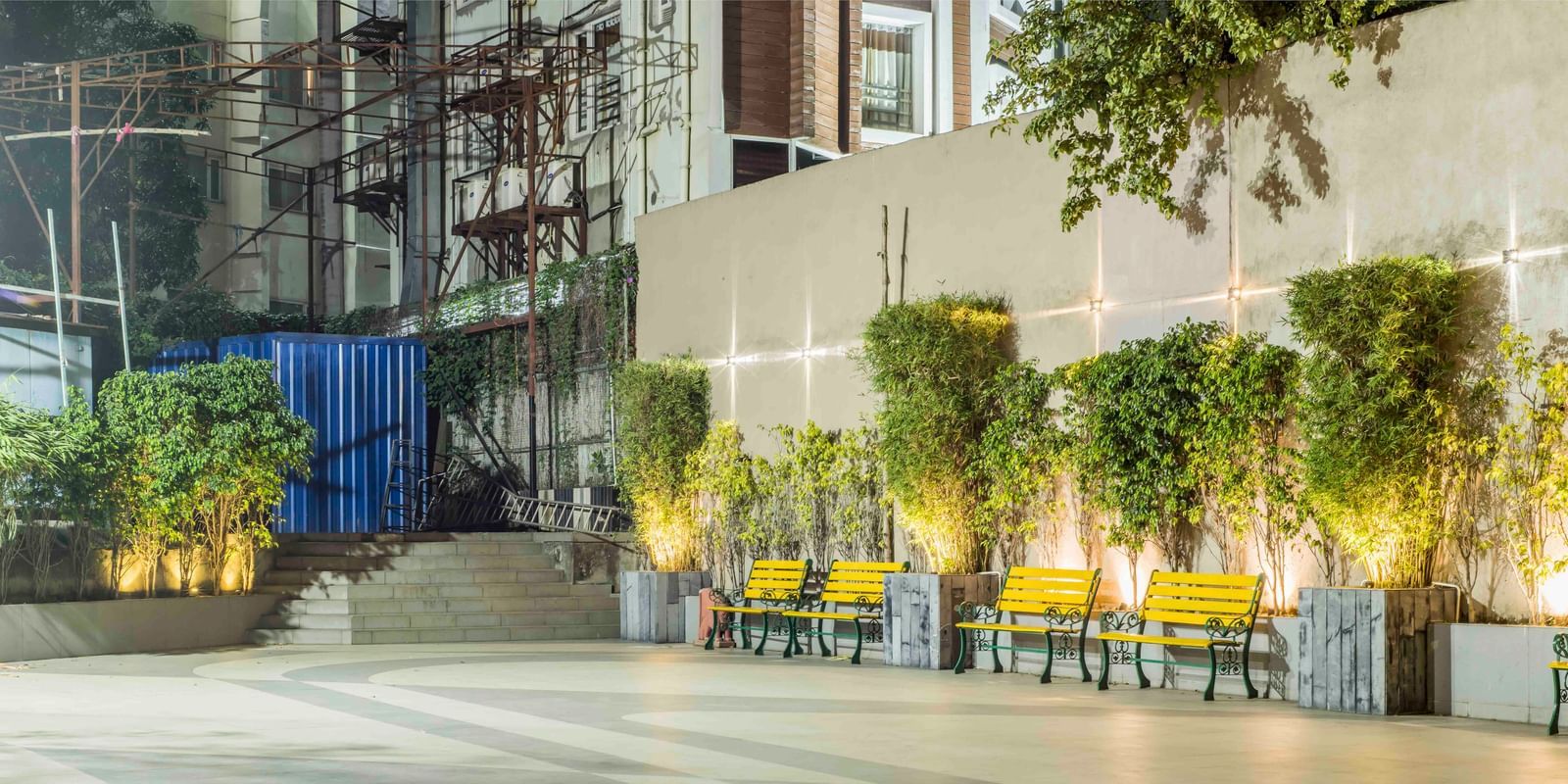 Bright and airy hotel courtyard with modern seating and lush green plants | The Citi Residenci Hotel Durgapur