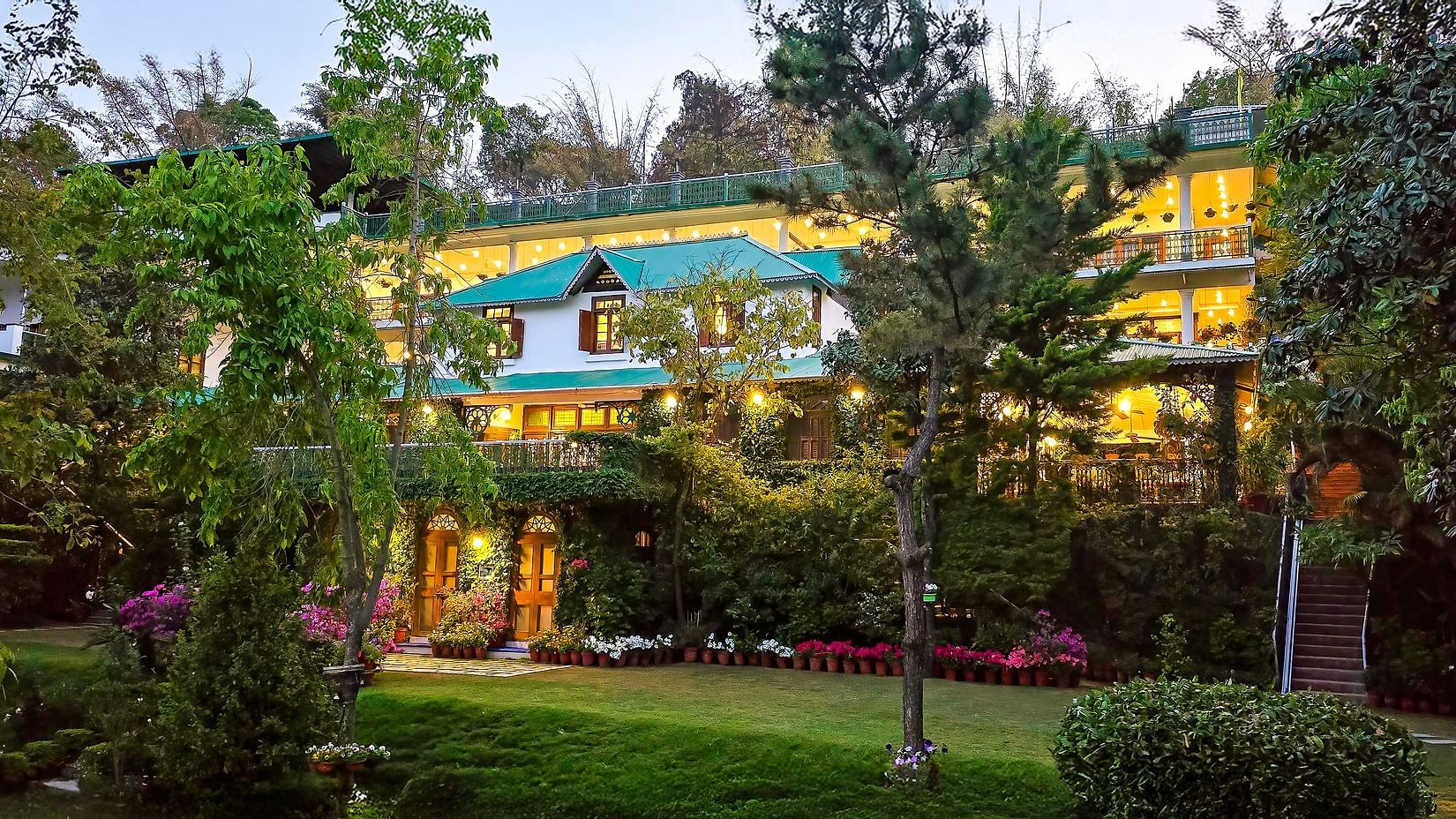 Pictutre of Shaheen Bagh-Dehradun, a luxury boutique resort and spa, with warm lights illuminating.