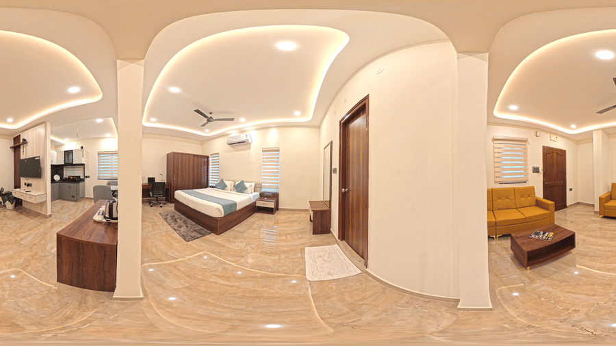 A 360-degree panorama shows a bedroom with a bed, seating, and furniture at Elysium Studio Suites, Madhapur.