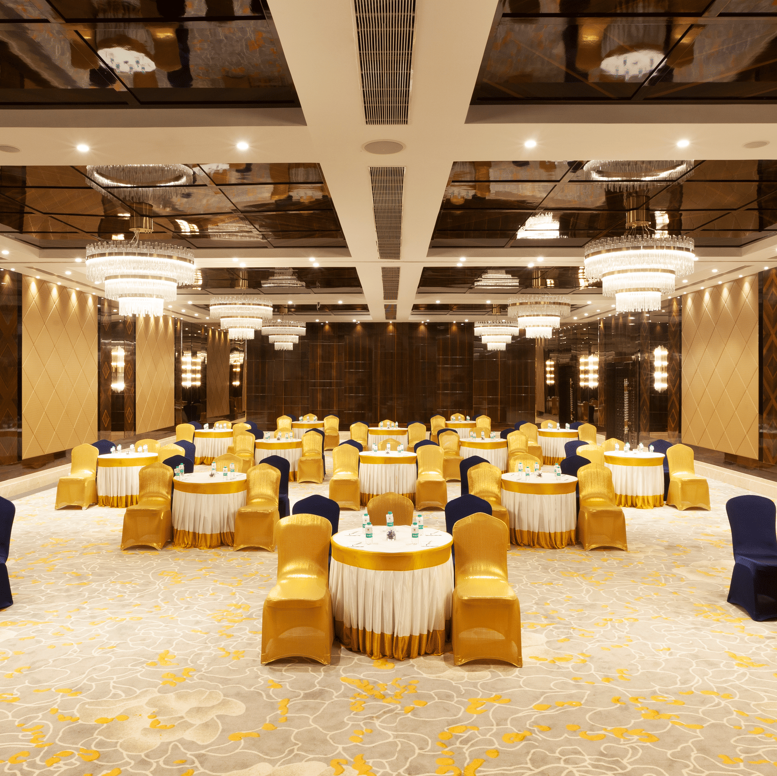 A banquet hall with round tables and chairs neatly arranged around them | Cenneys Gateway