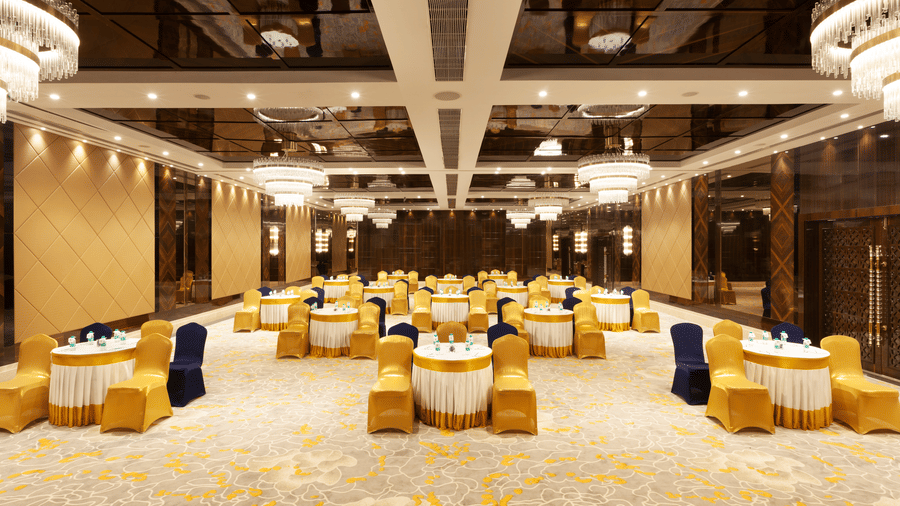 A banquet hall with round tables and chairs neatly arranged around them | Cenneys Gateway