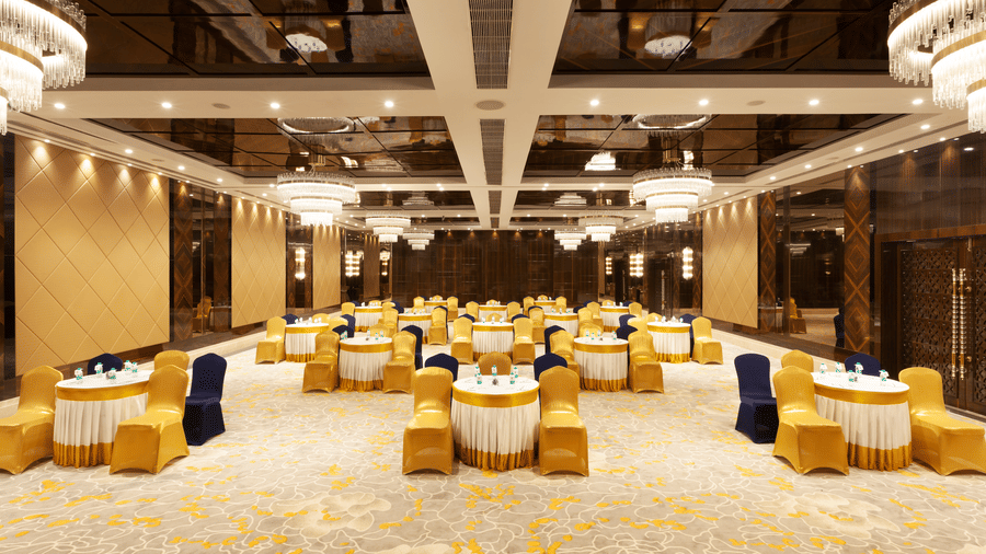 A banquet hall with round tables and chairs neatly arranged around them | Cenneys Gateway - Pride of Salem.