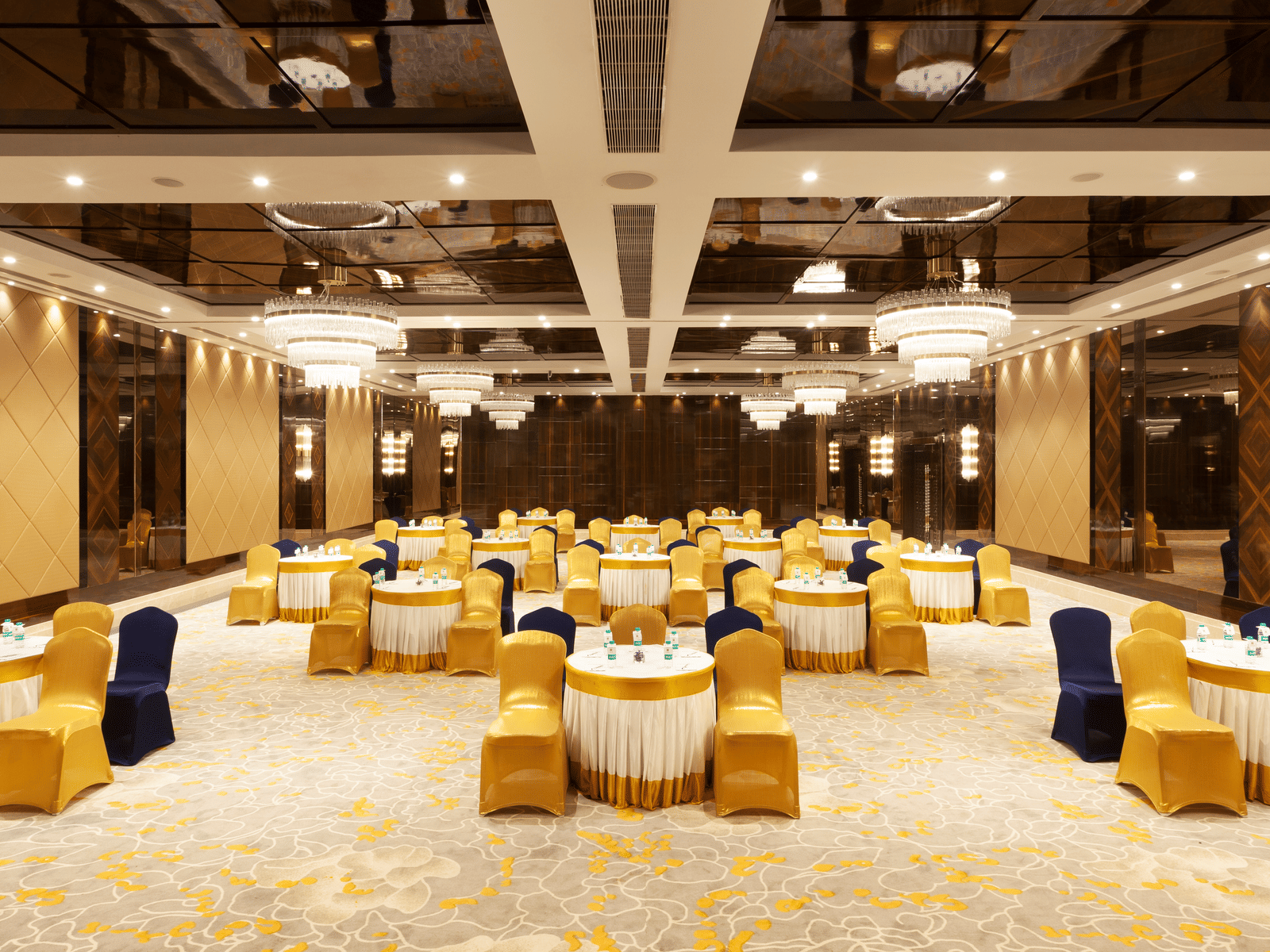 A banquet hall with round tables and chairs neatly arranged around them | Cenneys Gateway