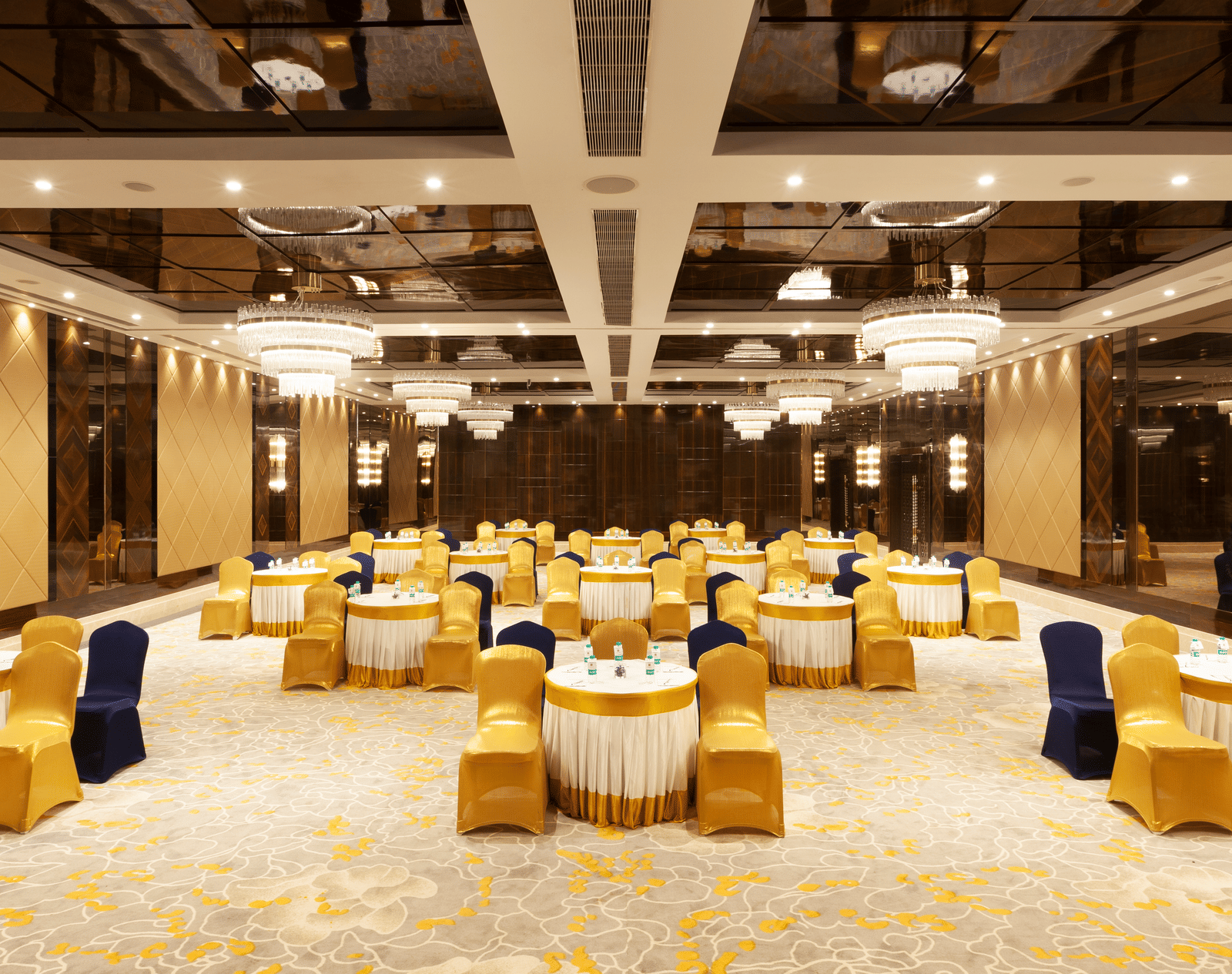 A banquet hall with round tables and chairs neatly arranged around them | Cenneys Gateway