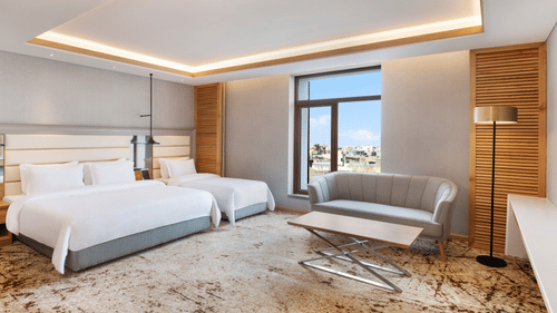 Deluxe Suites room with one queen bed and one single bed