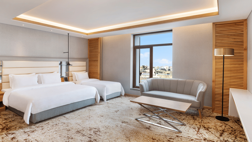 Deluxe Suites room with one queen bed and one single bed