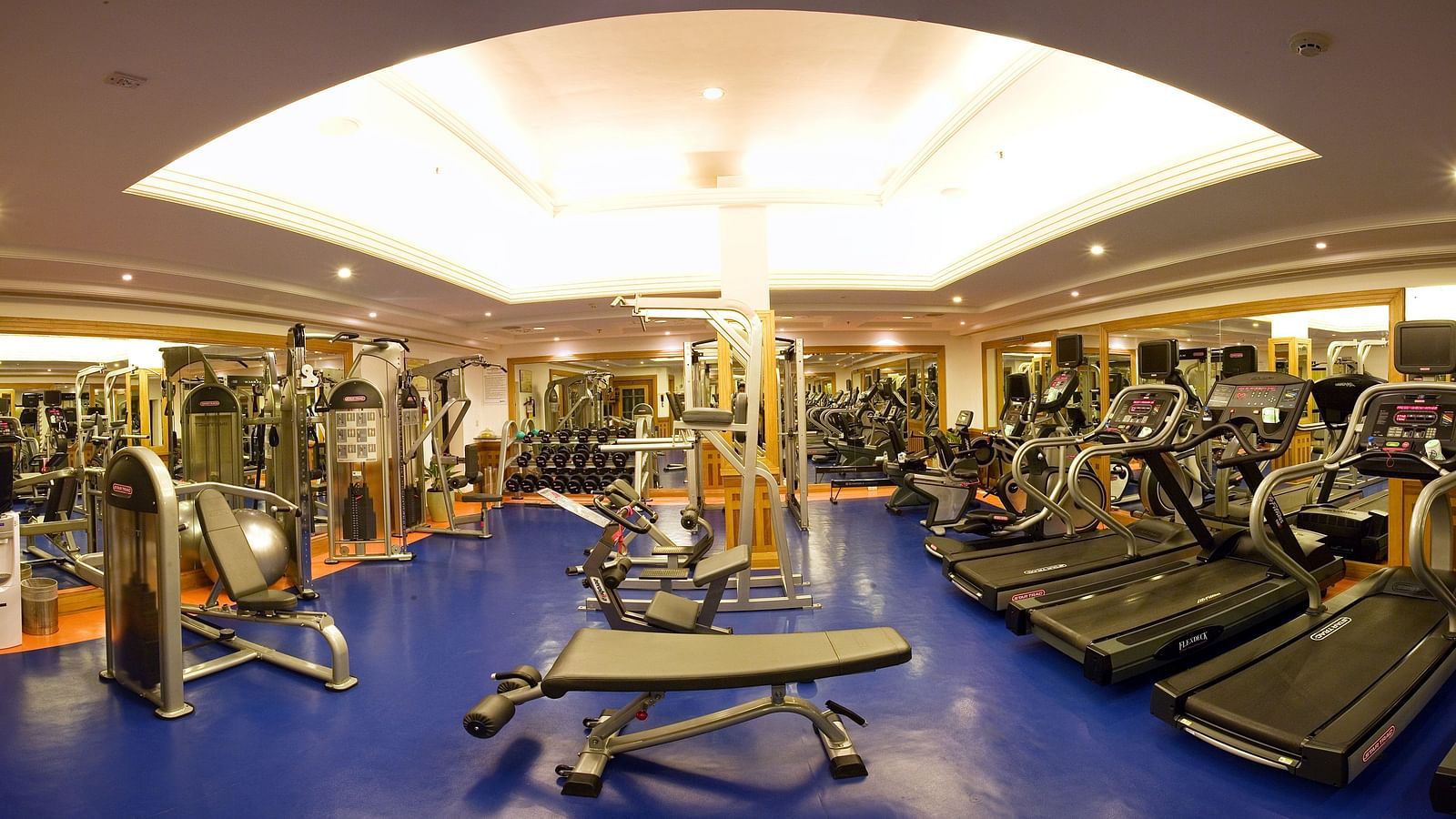 A front view of  well equipped gym at  Grand Chennai By GRT Hotels.