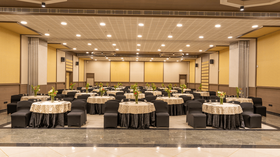 conference room set up with round tables and chairs for an event at The Golden Tusk, Jim Corbett