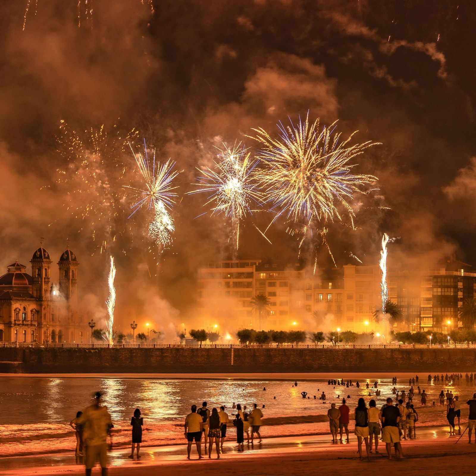 Crowd gathered in open area to see the fireworks in the sky during diwali.