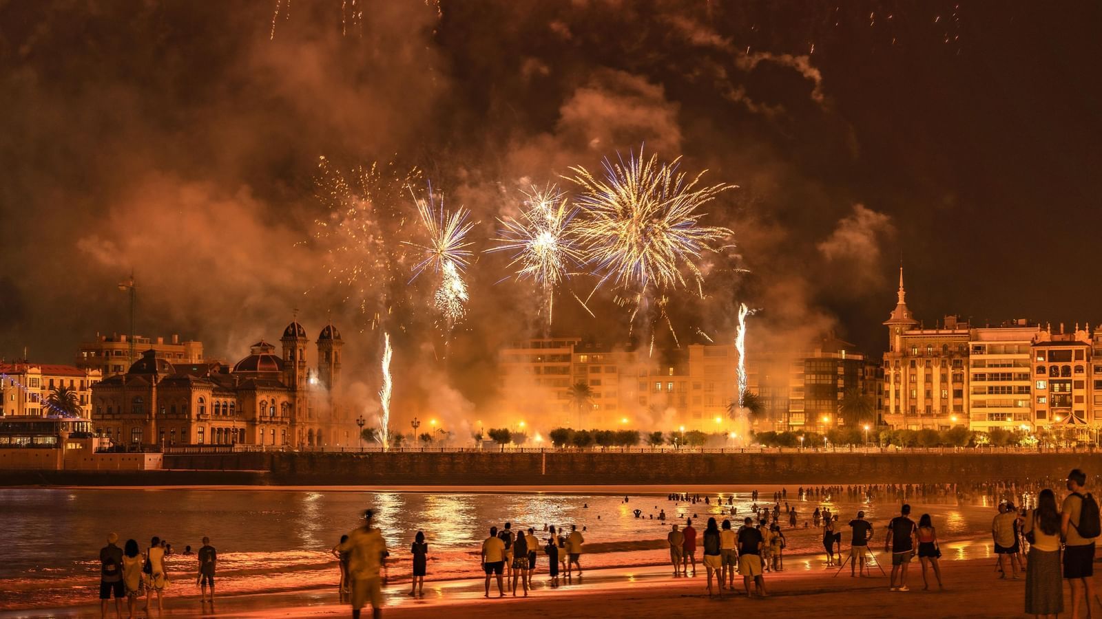 Crowd gathered in open area to see the fireworks in the sky during diwali.