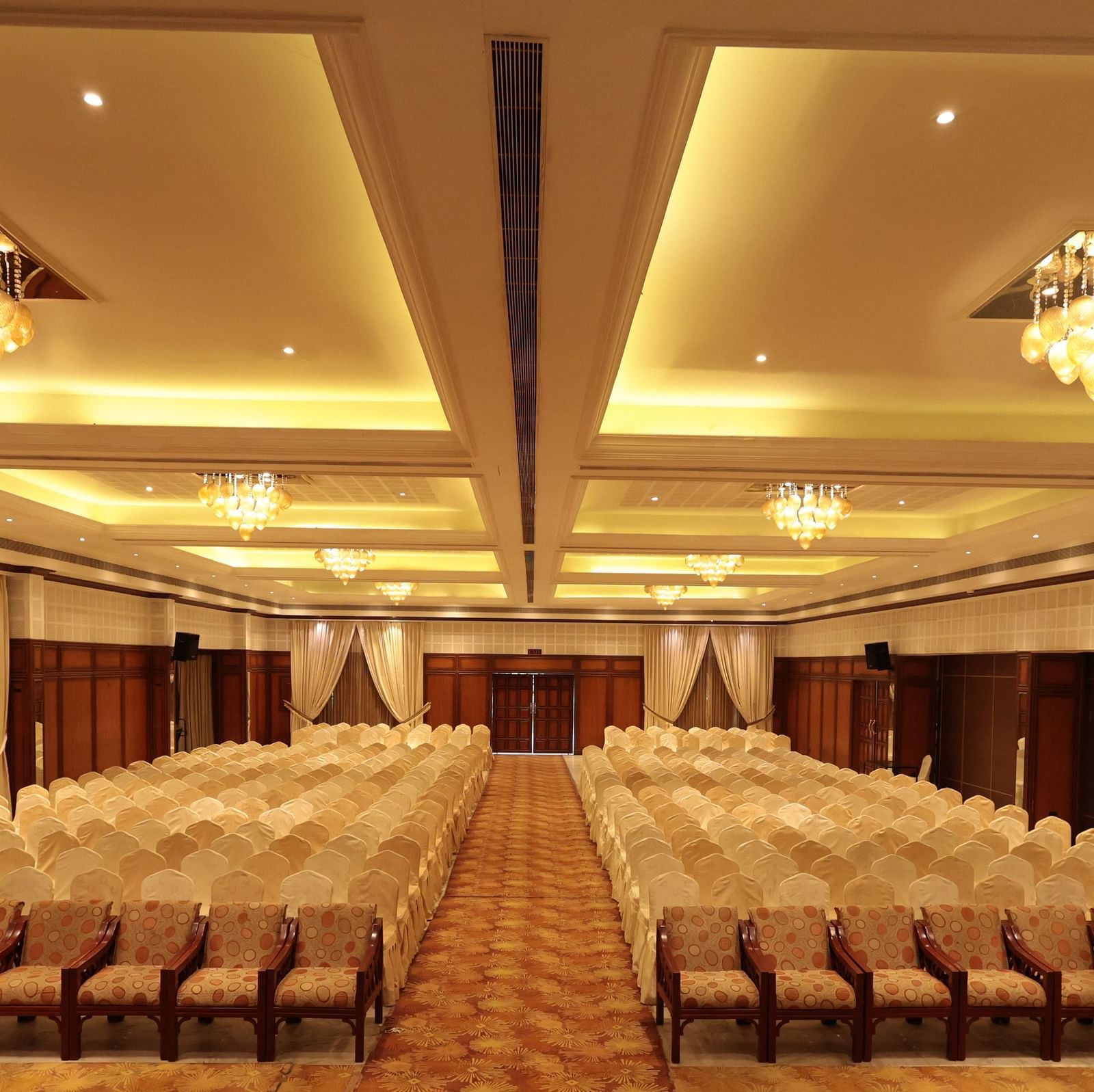 A complete view of the banquet hall with tables and chairs elegantly arranged on either side | Cenneys Gateway