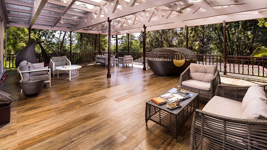the yoga deck with sofa sets on one side -  Mayfair Spa Resort & Casino Gangtok 