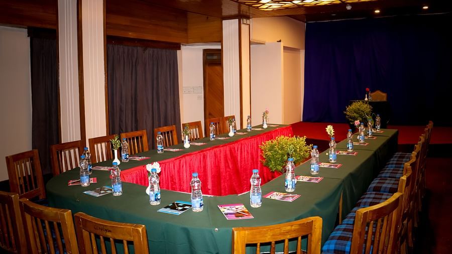 Long boardroom-style seating in a spacious event room, suited for formal business meetings - cedar inn