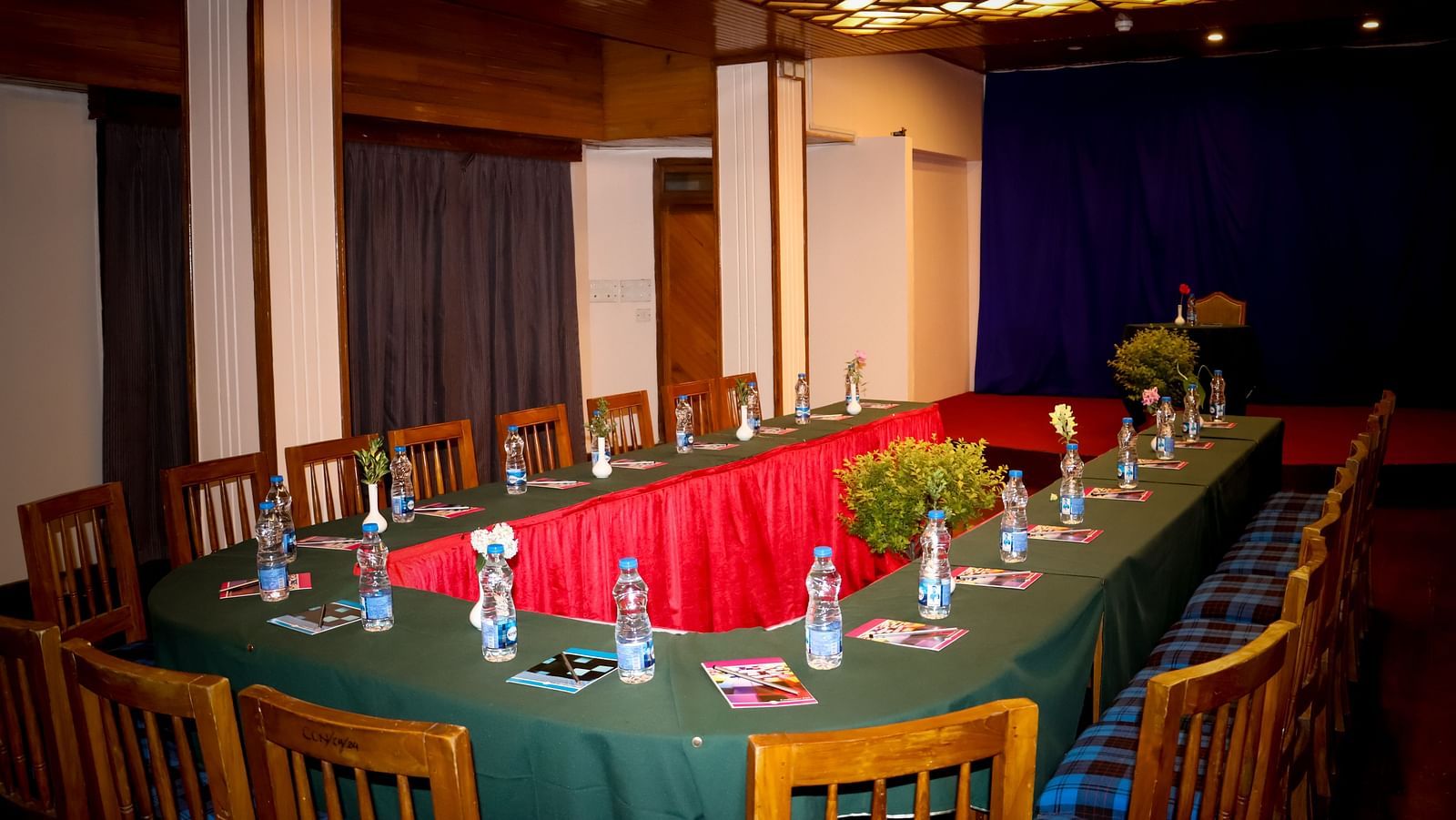 Long boardroom-style seating in a spacious event room, suited for formal business meetings - cedar inn