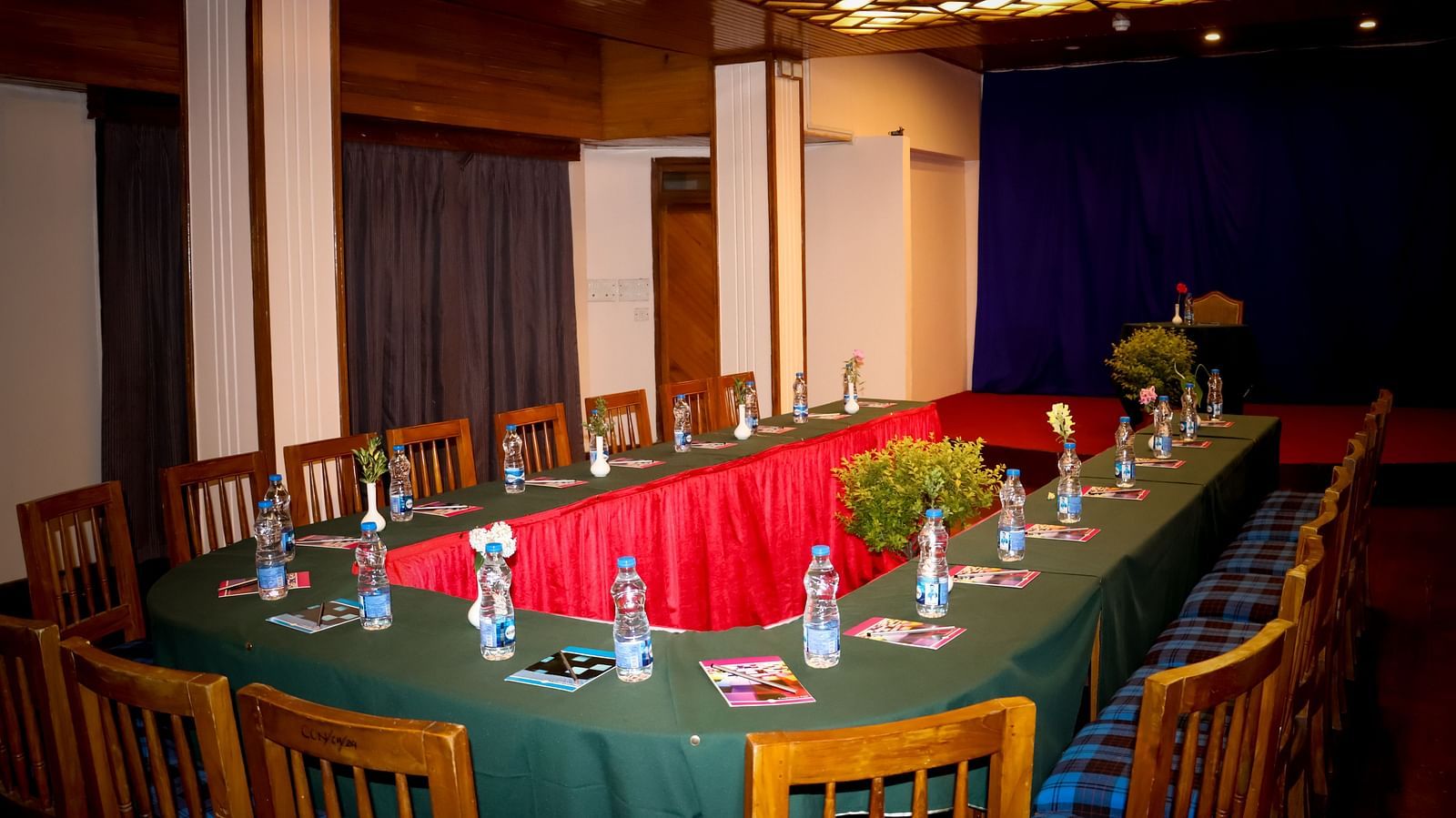 Long boardroom-style seating in a spacious event room, suited for formal business meetings - cedar inn