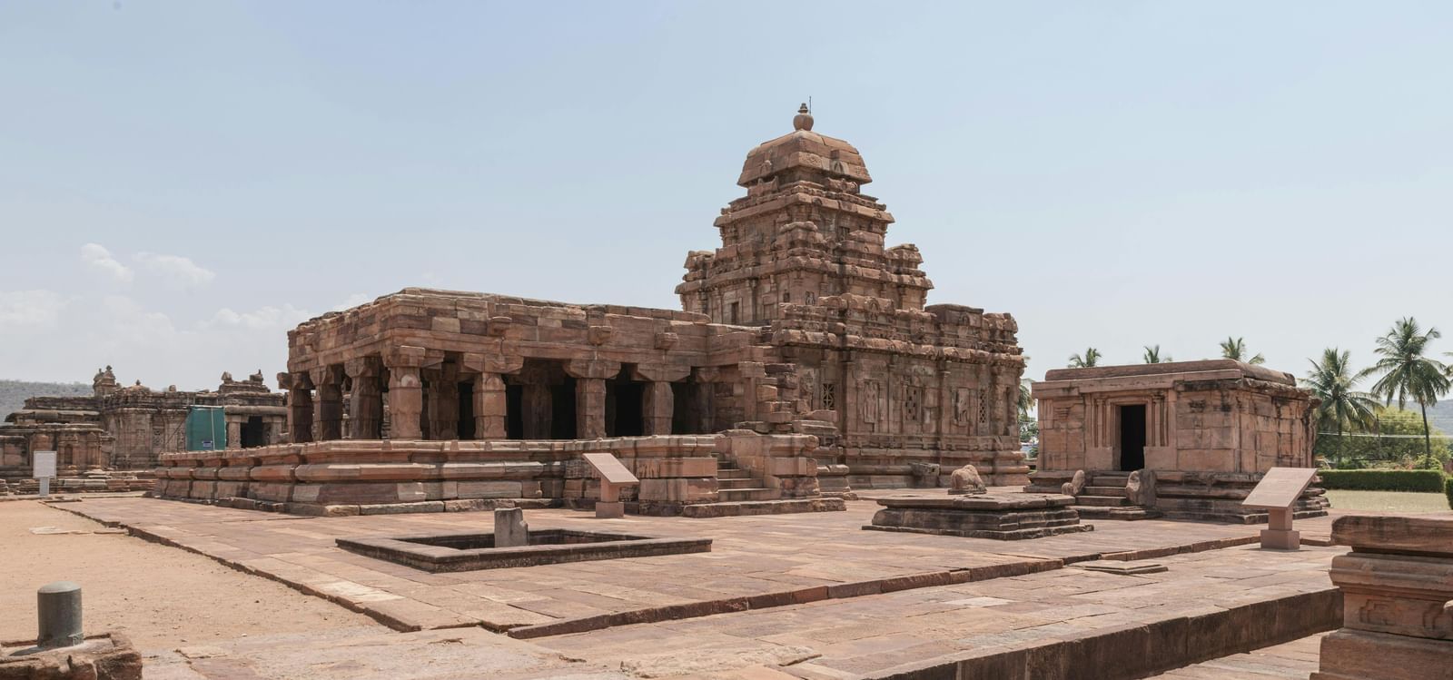 An ancient stone temple structure with detailed carvings.