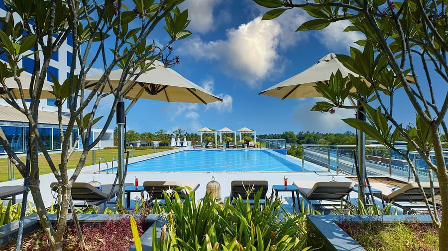 O by Tamara Trivandrum - view of the pool between trees