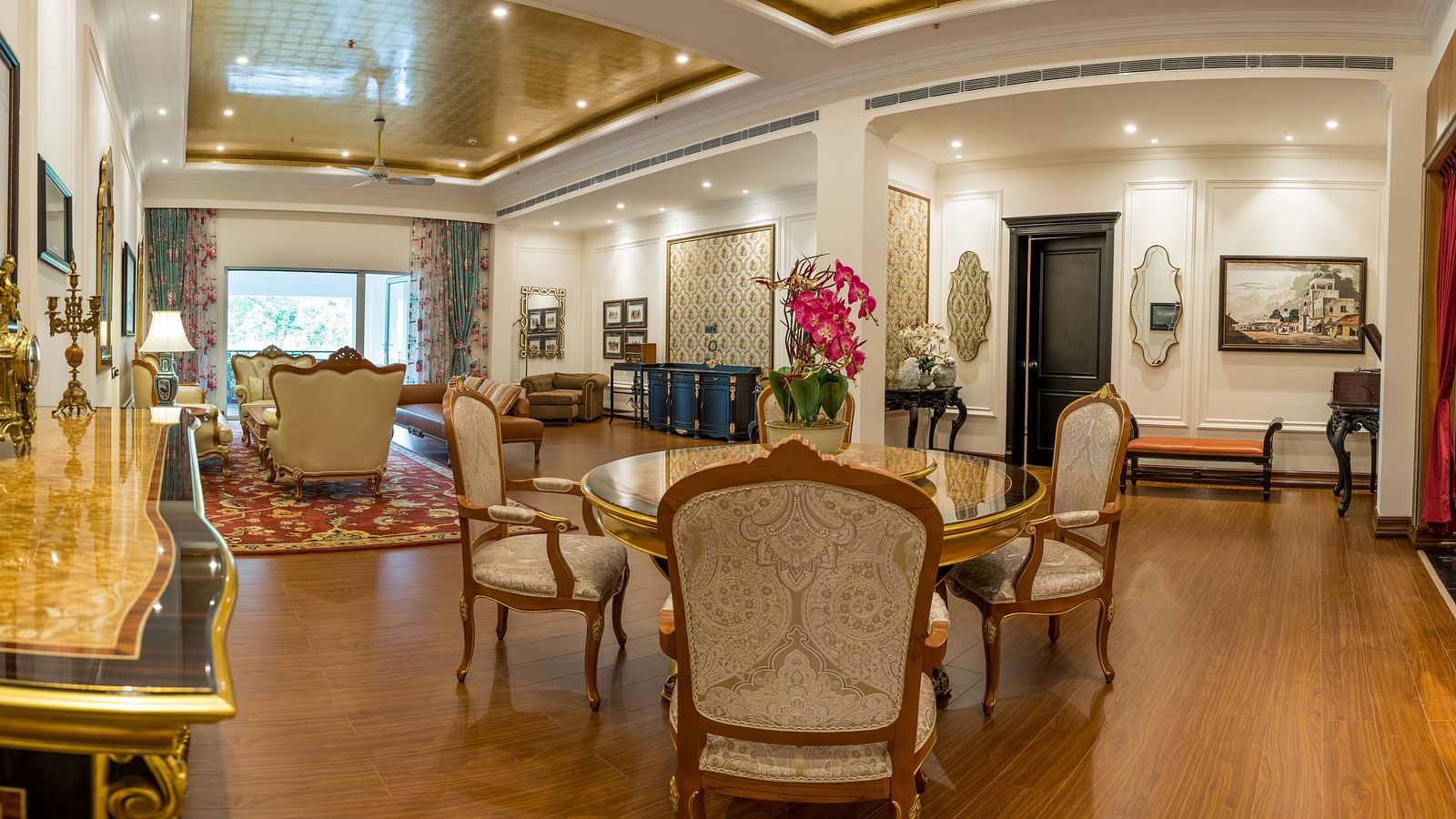 Grand lounge area with plush seating and chandelier at MAYFAIR Tea Resort, Siliguri