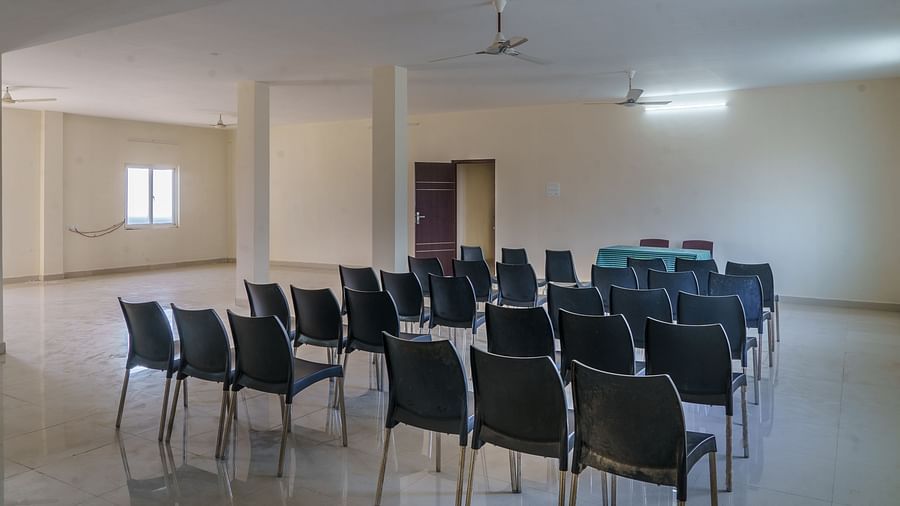 Back view of hall with sitting chairs at Wyt Hotels, Rameswaram