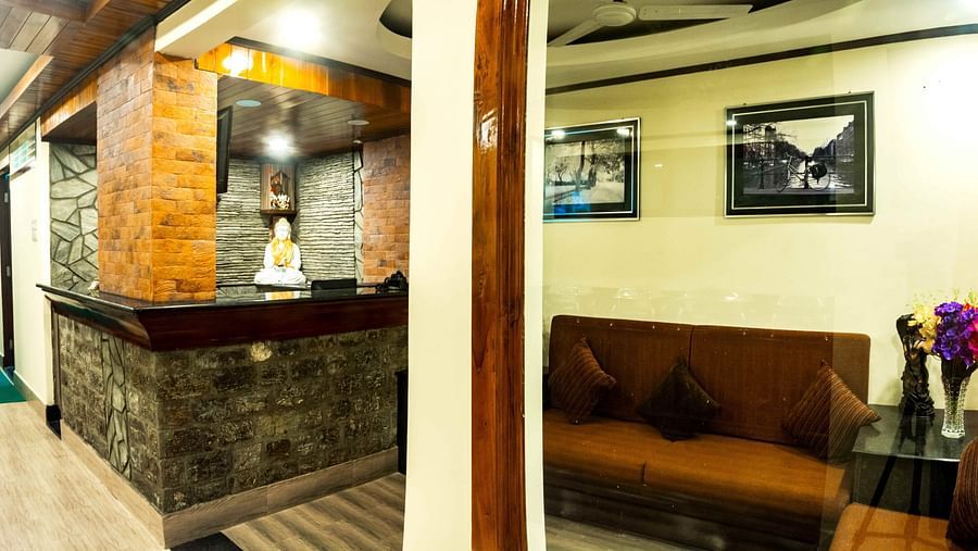 An image of the lobby at Ecotel Tin Tin, Bijanbari with a waiting area and the reception desk
