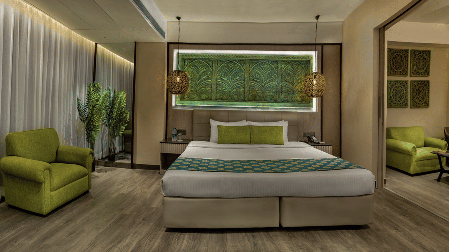Modern bedroom with plush bedding and relaxing ambience at The Sonnet, Jamshedpur.