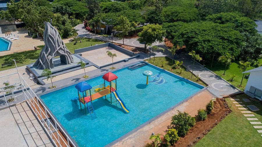 bird eye view of the kids pool lines with sky blue coloured tiles - Darza Resorts