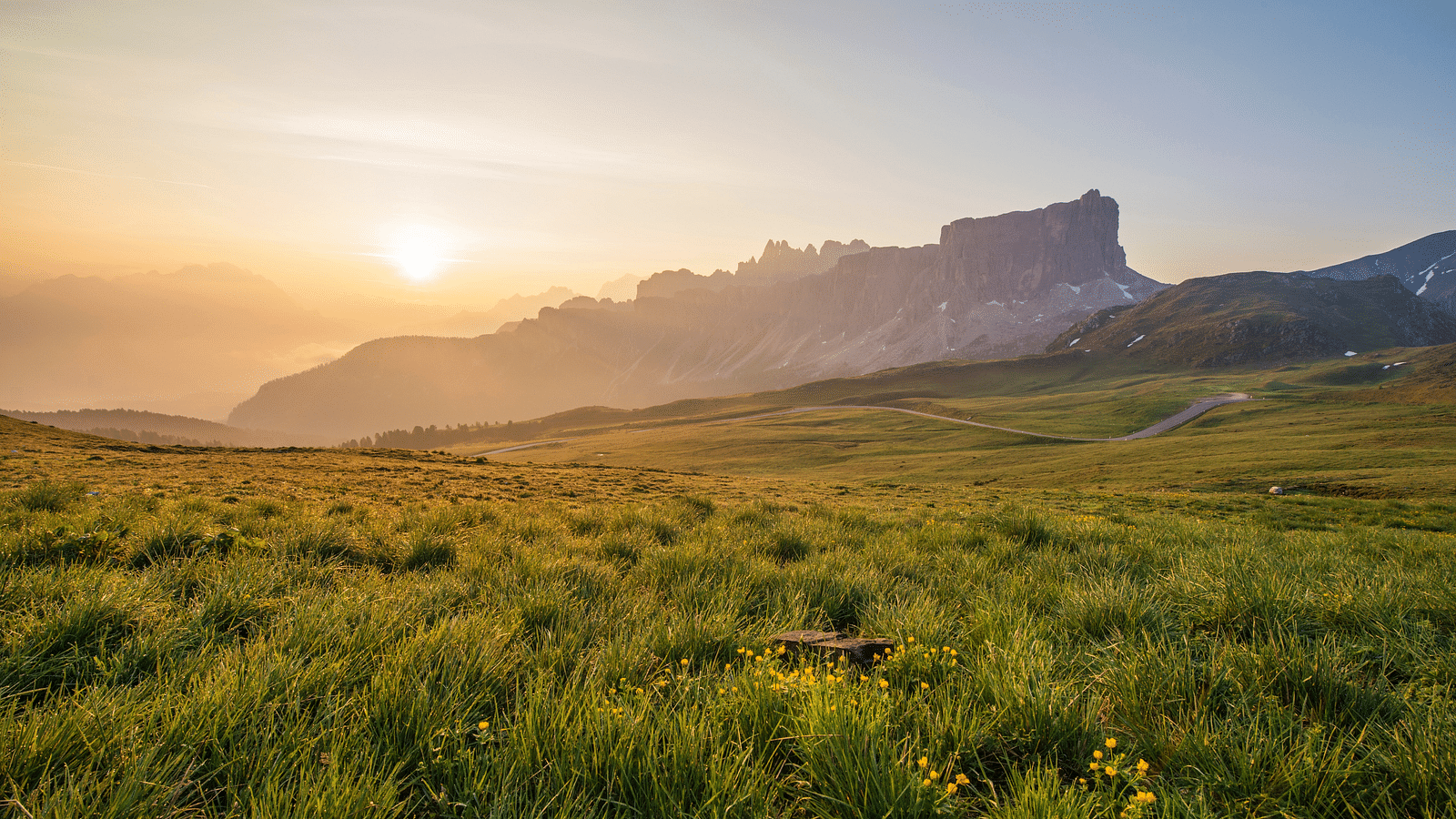 an image of overview of Grassy valley with sunset view