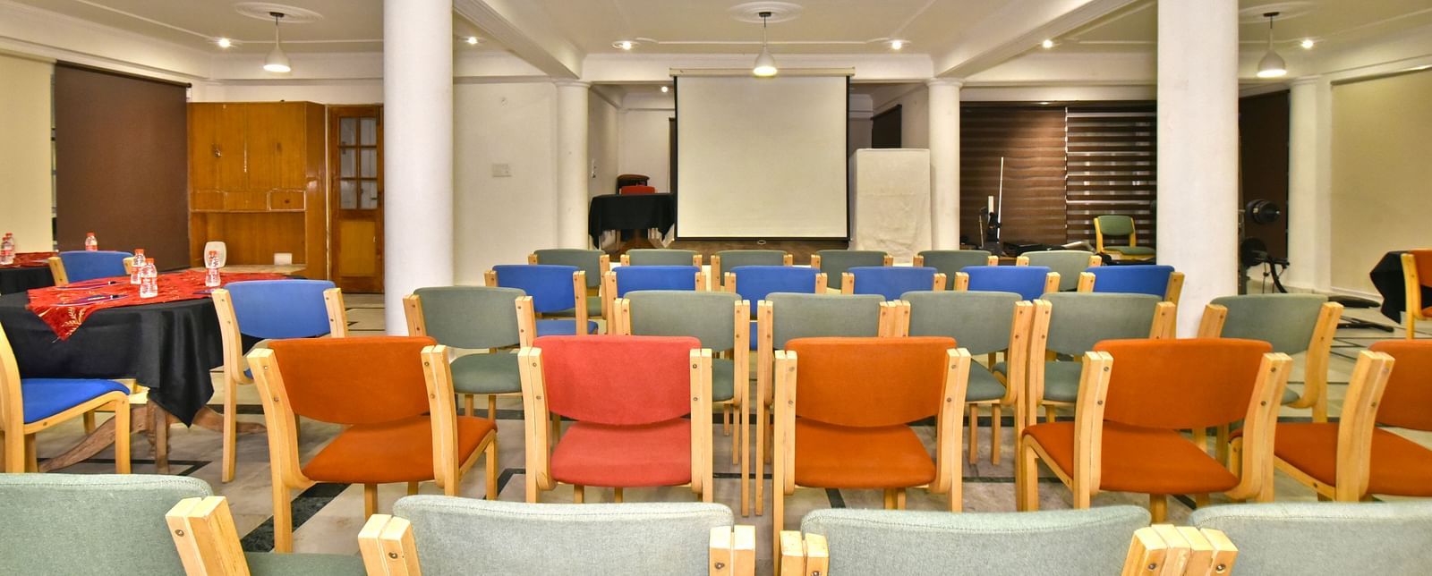 Back view of the event space with chairs arranged for a gathering at DLS Hillcrest Resort, Shimla.