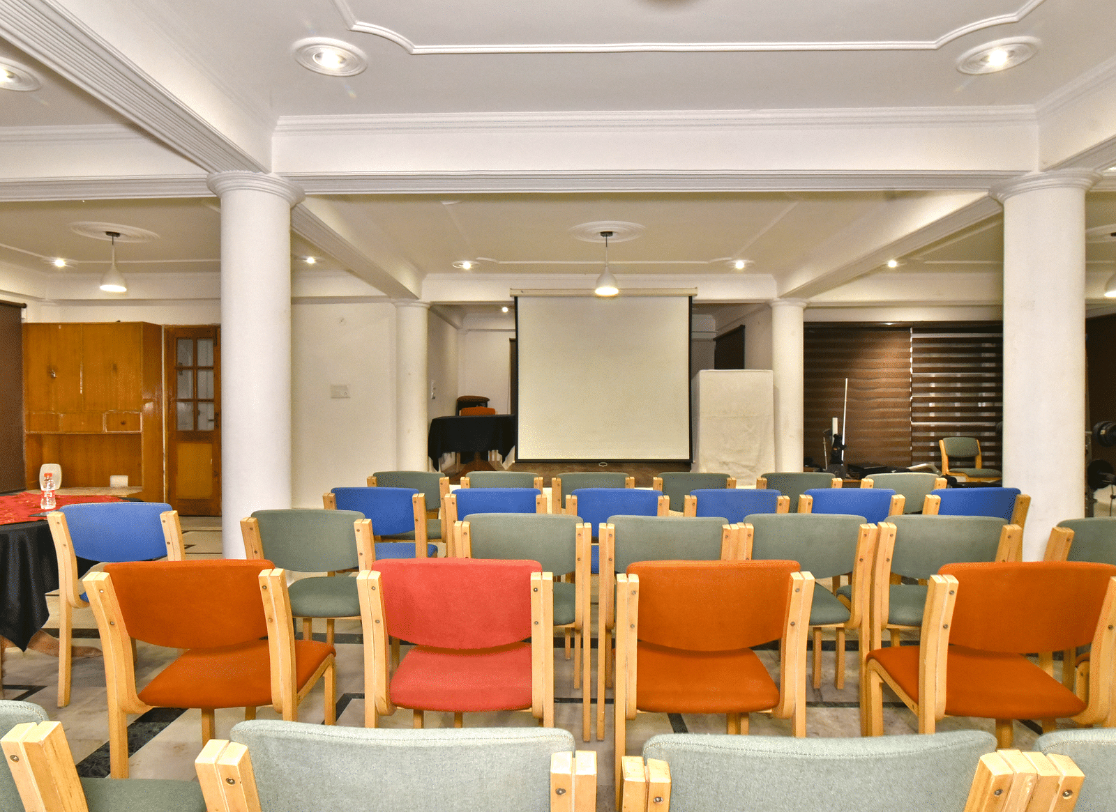 Back view of the event space with chairs arranged for a gathering at DLS Hillcrest Resort, Shimla.