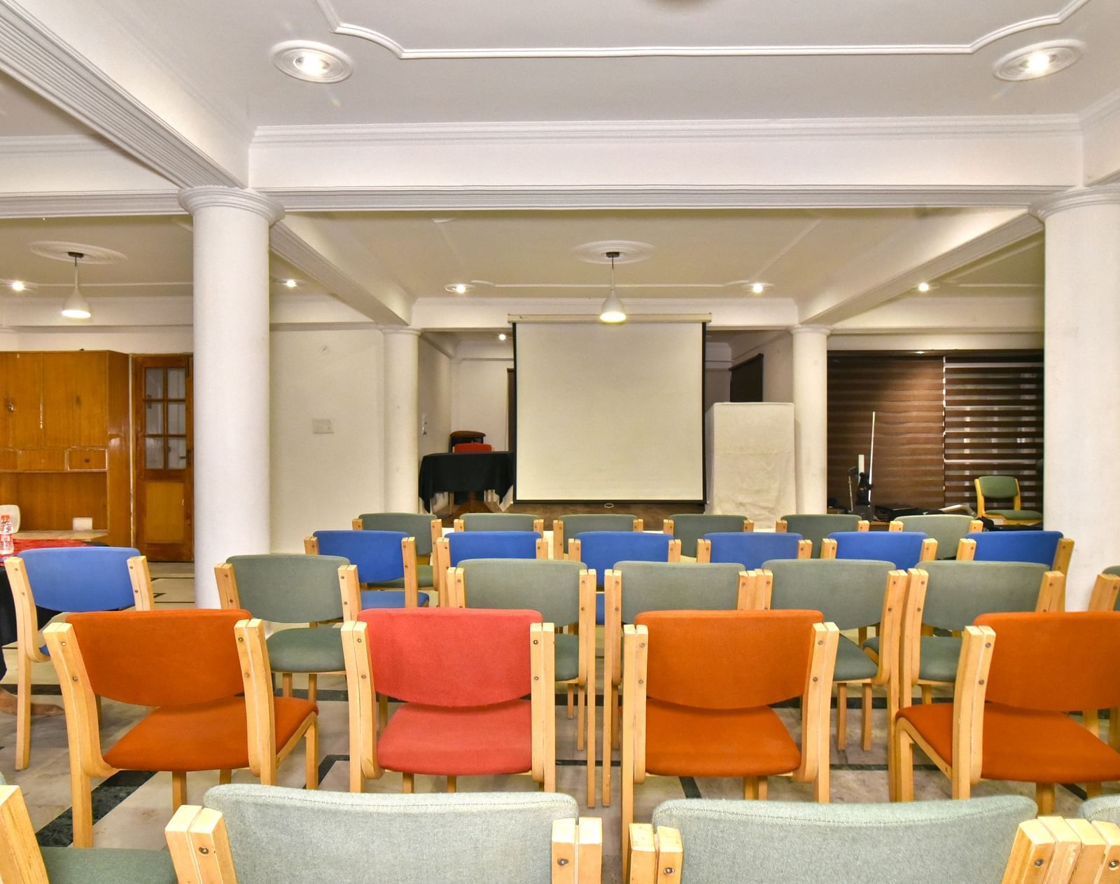 Back view of the event space with chairs arranged for a gathering at DLS Hillcrest Resort, Shimla.