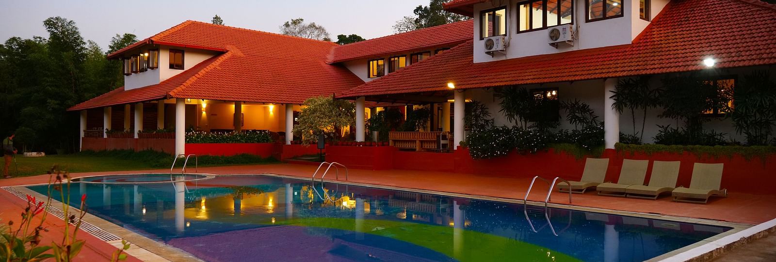 view of a rectangular swimming pool placed behind the property - Kadkani River Resort, Coorg