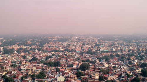 Bird's-eye view of Madhya Pradesh, showcasing miniature buildings dotting the landscape.