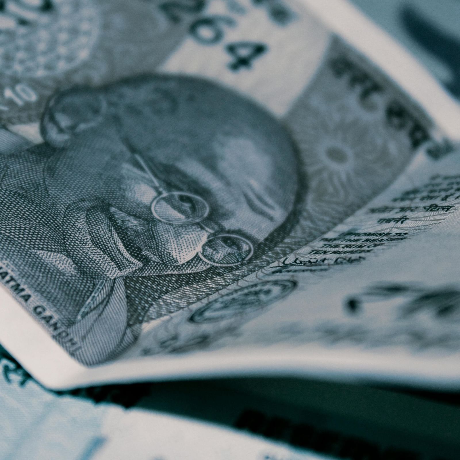 A close-up shot of several Indian Rupee banknotes.