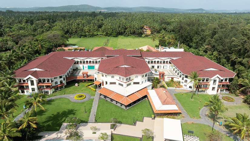 Aerial view of the resort building and surrounding gardens at Kenilworth Resort & Spa, Goa.