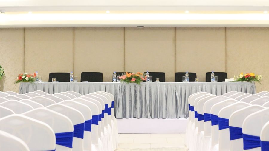 Central back view of a theatre style seating arrangement in a banquet hall at The Hamuse Hotel, Kodaikanal