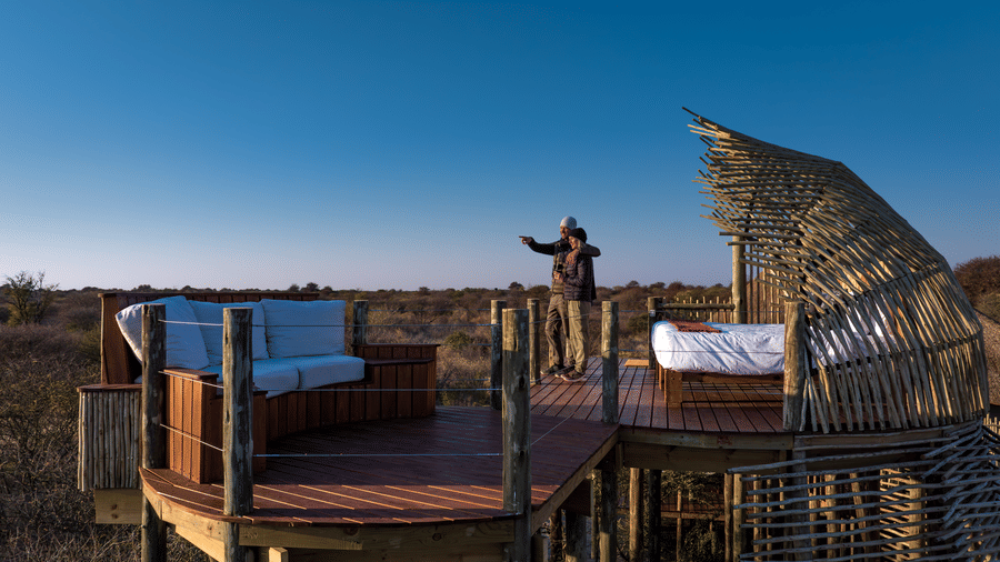 Woven starbed deck under a wide blue Kalahari sky at Evolve Back resort