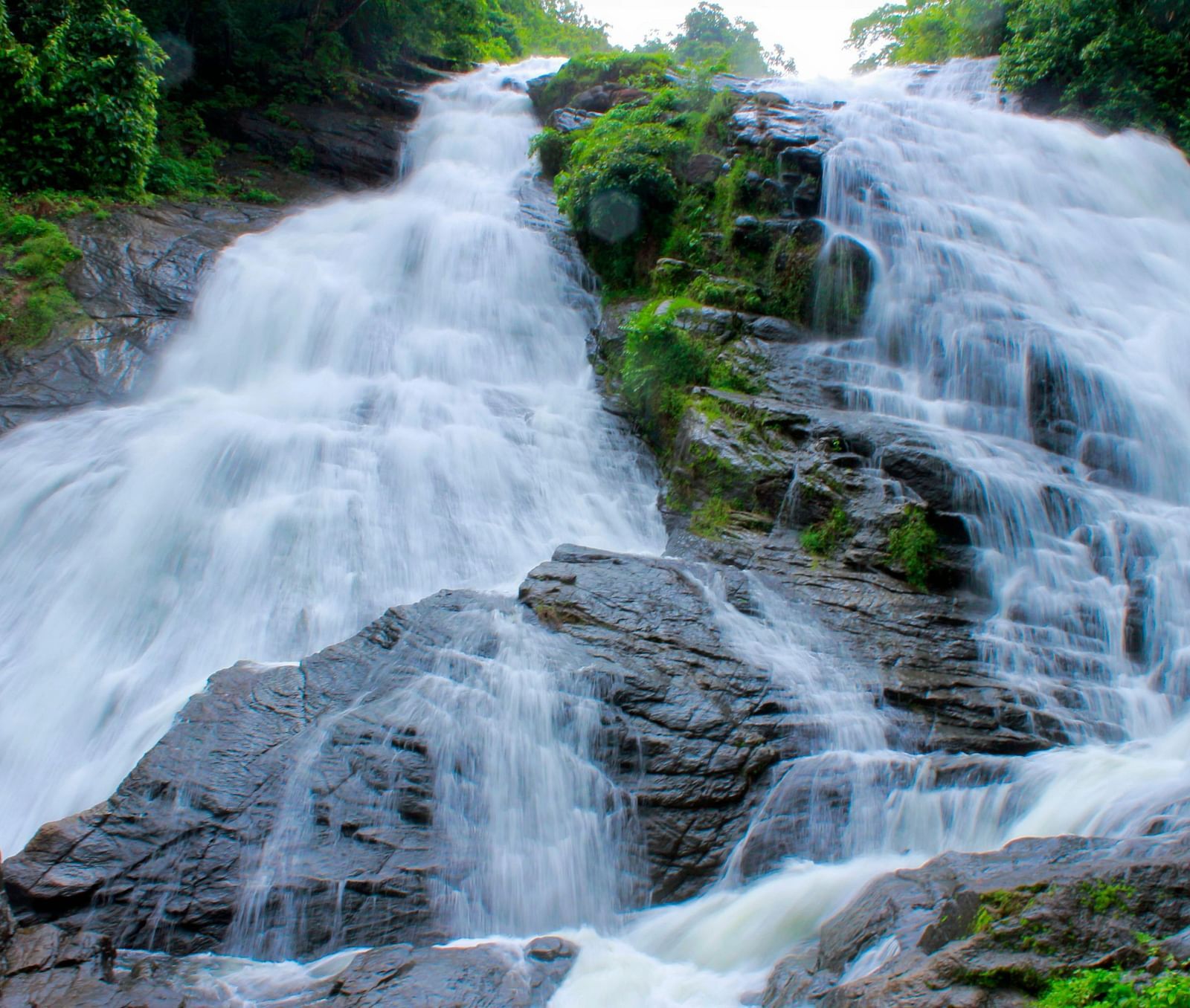 Water flows gently over a rocky slope.