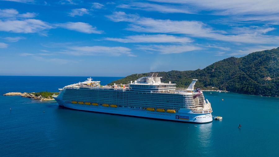 a white cruise floating in the middle of an ocean