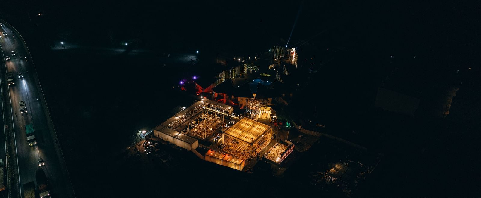 An aerial view captures a cluster of lights at night