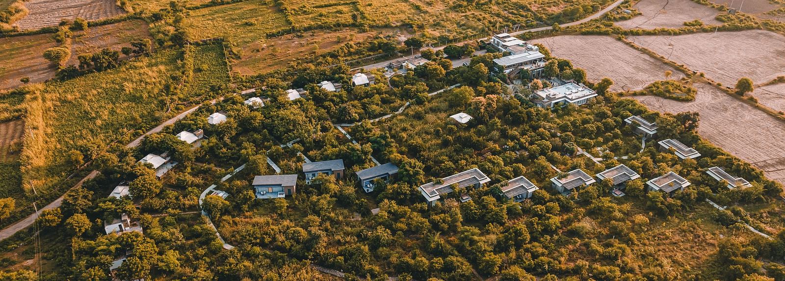An aerial image of the Utsav Camp Sariska showcasing the hotel and greenery around it