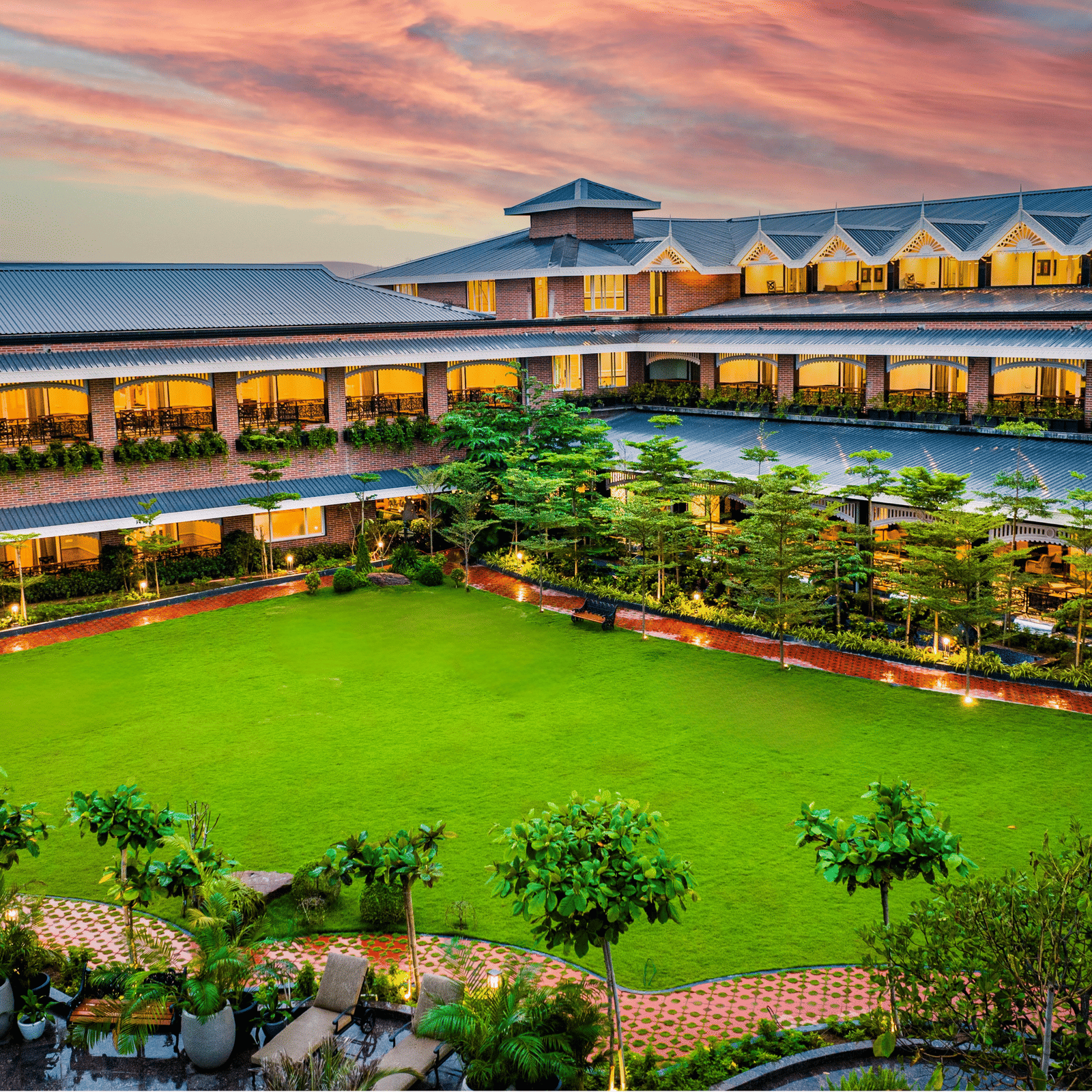 Panoramic exterior view of MAYFAIR Oasis Resort and Convention at dusk Jharsuguda