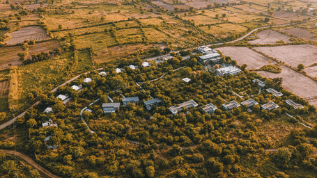 An aerial view of the Utsav Camp Sariska showcasing the hotel and greenery around it.