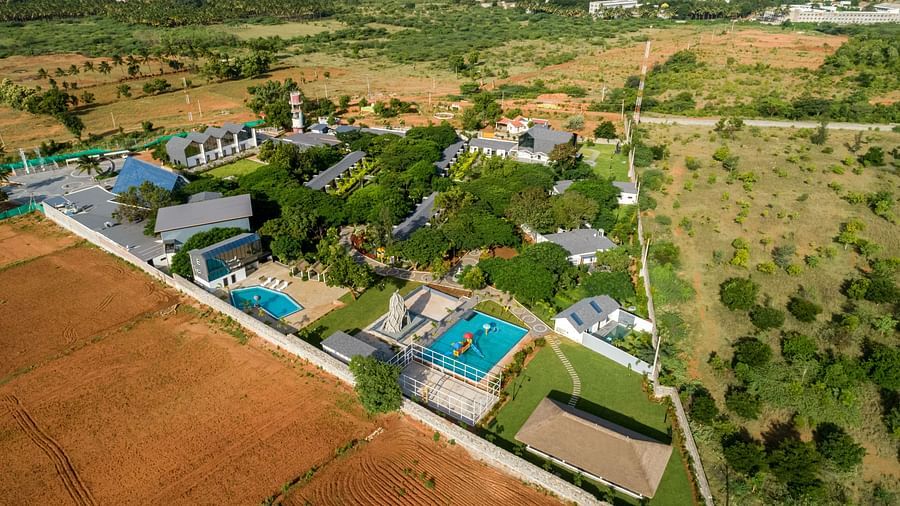bird eye view of darza resorts featuring the various cluster of villas and the swimming pools