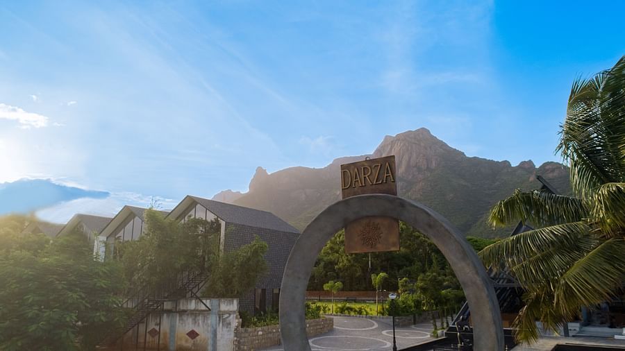 an image featuring the logo of darza resorts with a bright blue sky in the background