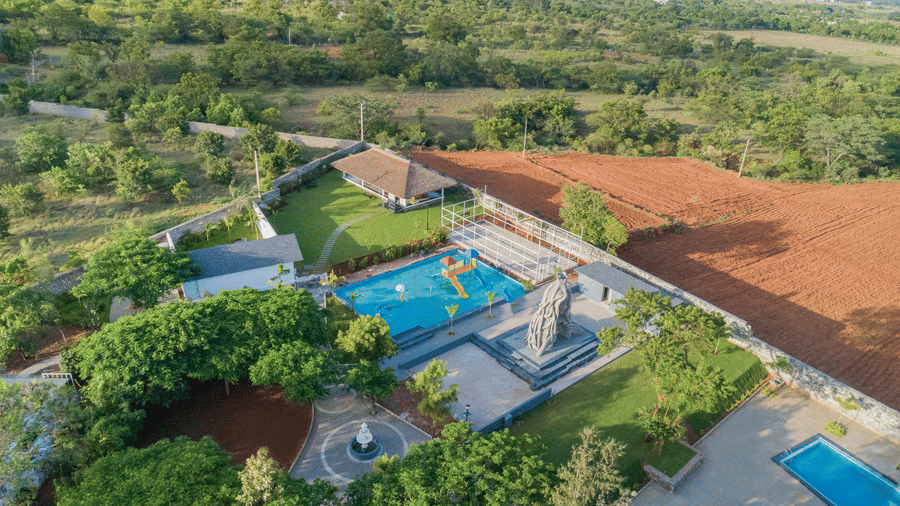 Bird eye view of swimming pools and the lush greenery in and around - Darza Resorts.