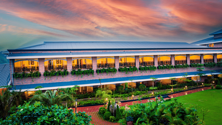 Stunning exterior facade of MAYFAIR Oasis Resort and Convention under a vibrant sunset sky Jharsuguda