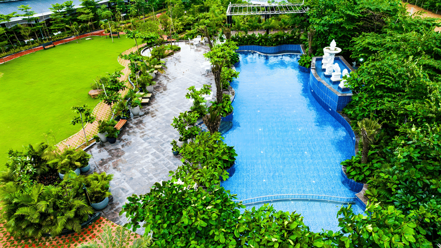 Aerial view of resort pool and tropical garden landscape at MAYFAIR Oasis Resort and Convention Jharsuguda