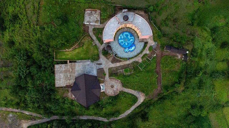 Aerial view of the Osian Valley Resort & Spa, showing the main buildings, surrounding landscape, and a swimming pool.