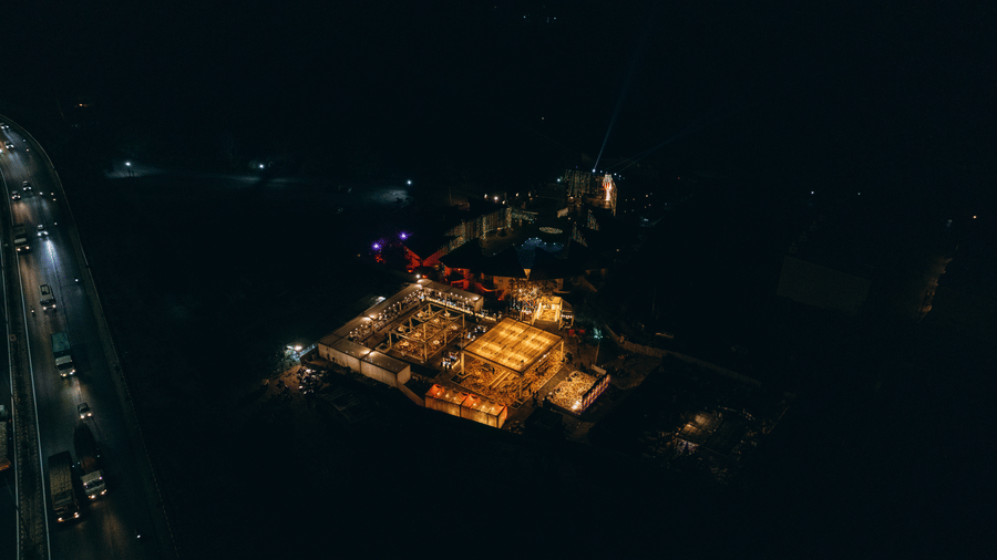 An aerial view captures a cluster of lights at night
